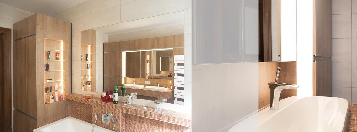 Mit Mosaikfliesen eingefasste Badewanne und Detail Waschbecken mit umlaufendem LED-Flächenlicht